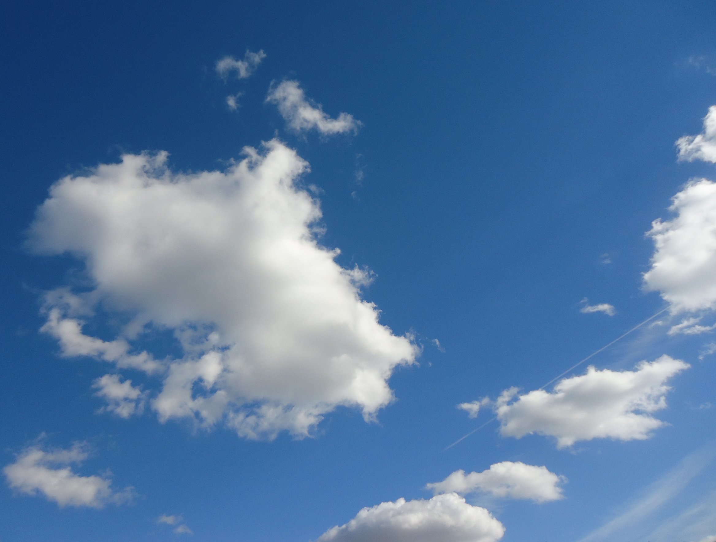 Clouds On A Mostly Clear Sky Free Public Domain Stock Photo