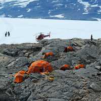Tents and Helicopters on the Rocky Terrain in Greenland