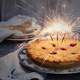 Birthday Pie with three sparklers as Candles