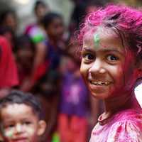 Child with paint on her in Mumbai, India