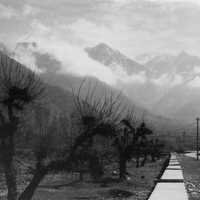 Black and White photo with path into the mountains with clouds in Srinagar, India