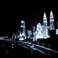 Downtown cityscape of Kuala Lumpur at night in Malaysia