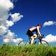 cyclist-riding-under-blue-skies