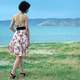 girl-walking-on-the-shore-in-backless-dress