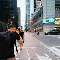 guy-taking-picture-of-girl-on-the-street