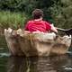 man-sitting-in-a-rowboat-rowing-away