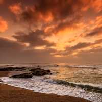 Seashore at dusk with waves and clouds in Nkwazi, South Africa
