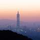 Taipei 101 at dusk under the reddish skies and haze in Taiwan