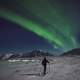 Man skiing under the aurora borealis