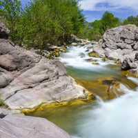 Sally May on Fossil Creek landscape and rapids