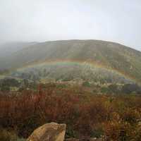 Rainbow under the mountain landscape