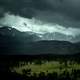 Mountain and forest landscape in Colorado under stormy skies