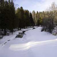 Downstream with snow and ice on the Gooseberry River at Gooseberry falls State Park, Minnesota