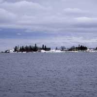 Peninsula with trees and houses on Lake Superior in Grand Marais, Minnesota