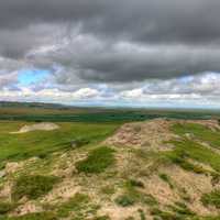 Clouds and trail to the horizon at White Butte, North Dakota