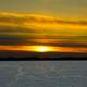 Large sunset over snowy Mendota in Madison, Wisconsin