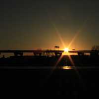 Sun behind highway bridge in Milwaukee, Wisconsin