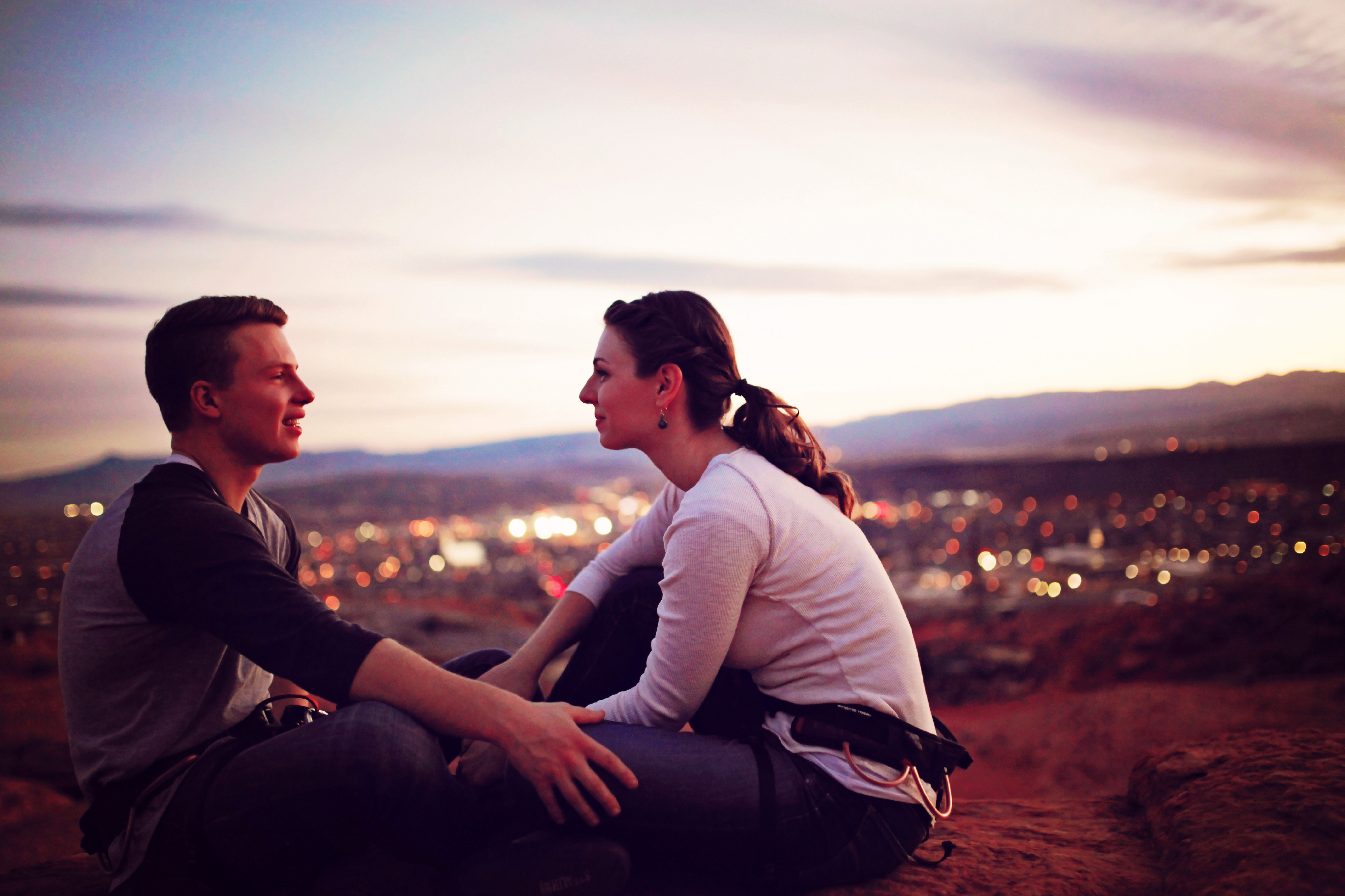 Young Couple Sitting Together On A Hill Overlooking A Town Image Free Stock Photo Public Domain Photo Cc0 Images