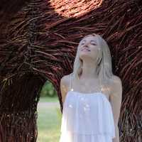 woman-in-white-dress-looking-up-smiling