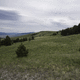 Overlapping hill landscape with mountains in the background in Helena ...