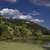 Cornfields, hill, and houses with clouds and sky image - Free stock ...